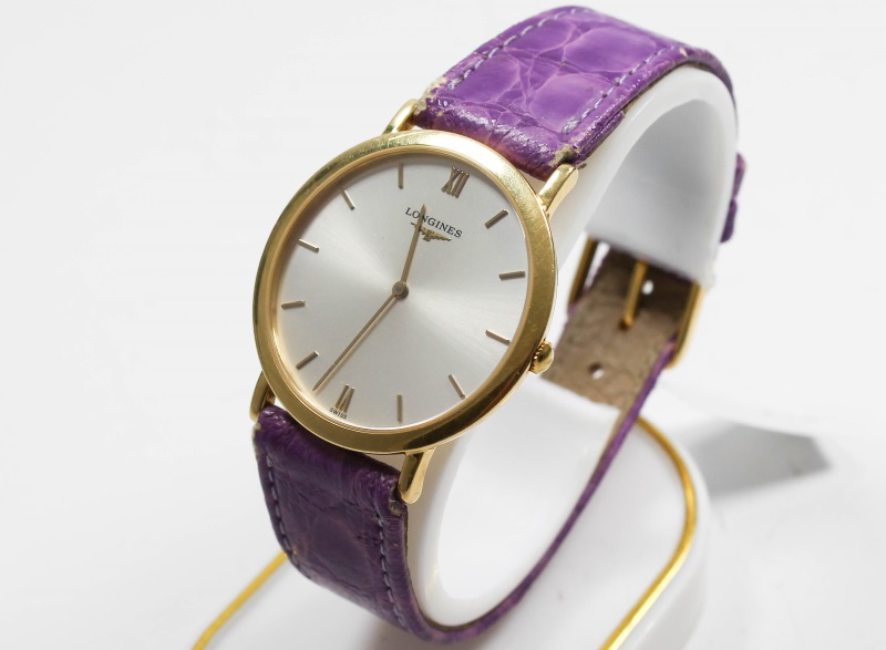 Für das Online Pfandhaus für Marl Longines Quarz Gold Armbanduhr 18 Karat Gold lila Lederarmband